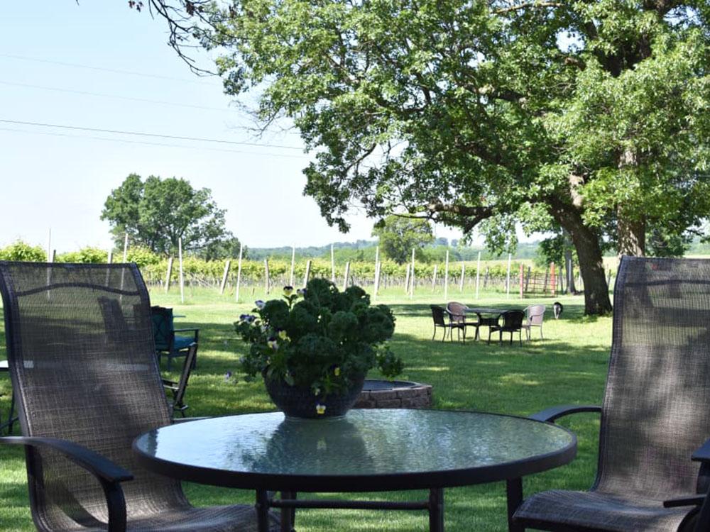 Table and 2 chairs at HOPEWELL BRIDGE WINERY & RV PARK