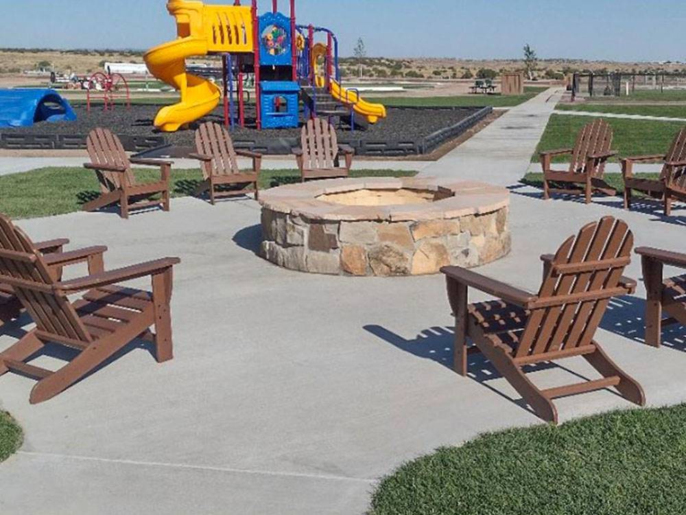 Chairs around a fire pit at Love's RV Stop - 873