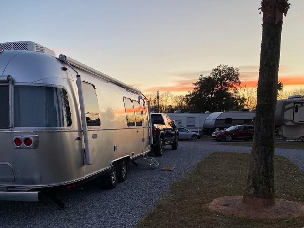 An Airstream motorhome at dusk at PALM COVE RV VILLAGE