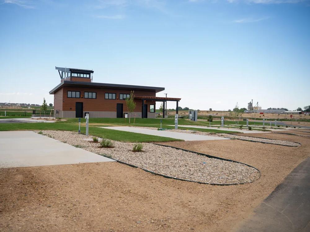 Row empty RV lots near building at GOPHER GULCH RV & CAMPGROUND