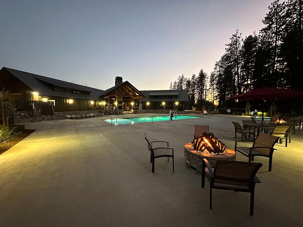 Pool lit up at night at GRASS VALLEY RV RESORT