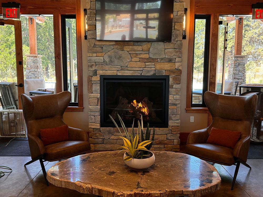 Fireplace area in the lobby at GRASS VALLEY RV RESORT