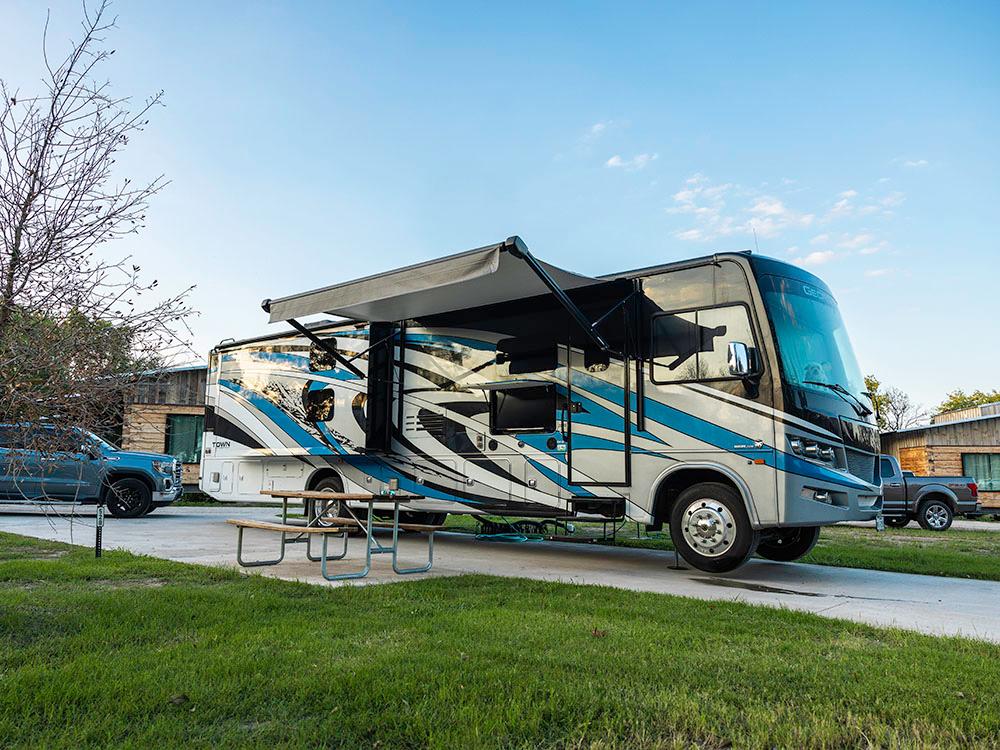 RV with open awning at CAMP FIMFO WACO