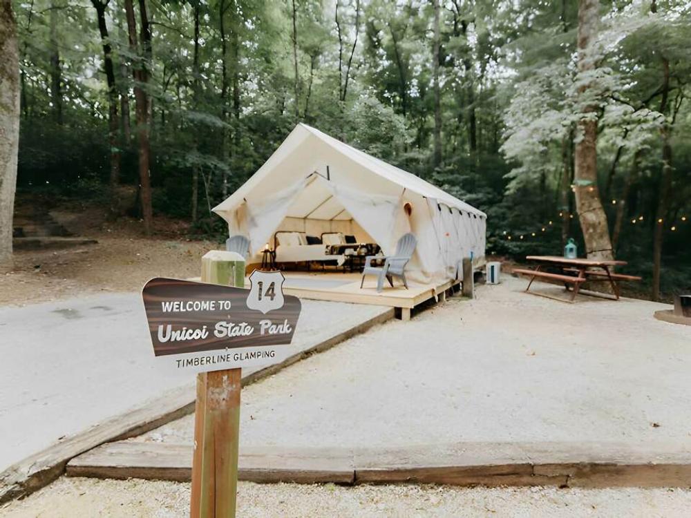 Large glamping tent with a deck at Timberline Glamping at Unicoi State Park