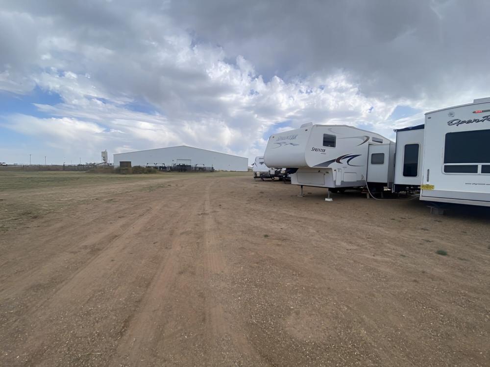 Parked trailer at site Mosquero RV and Stalls