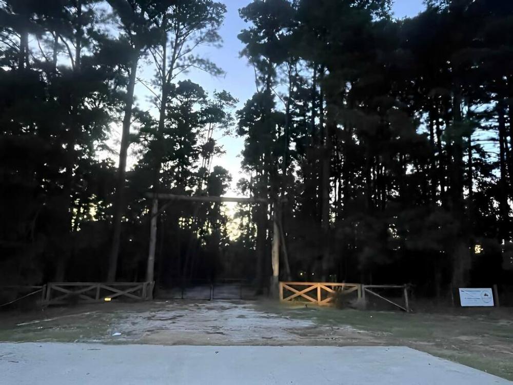 Entrance to park at dusk at Rustic Pine RV Park 55+