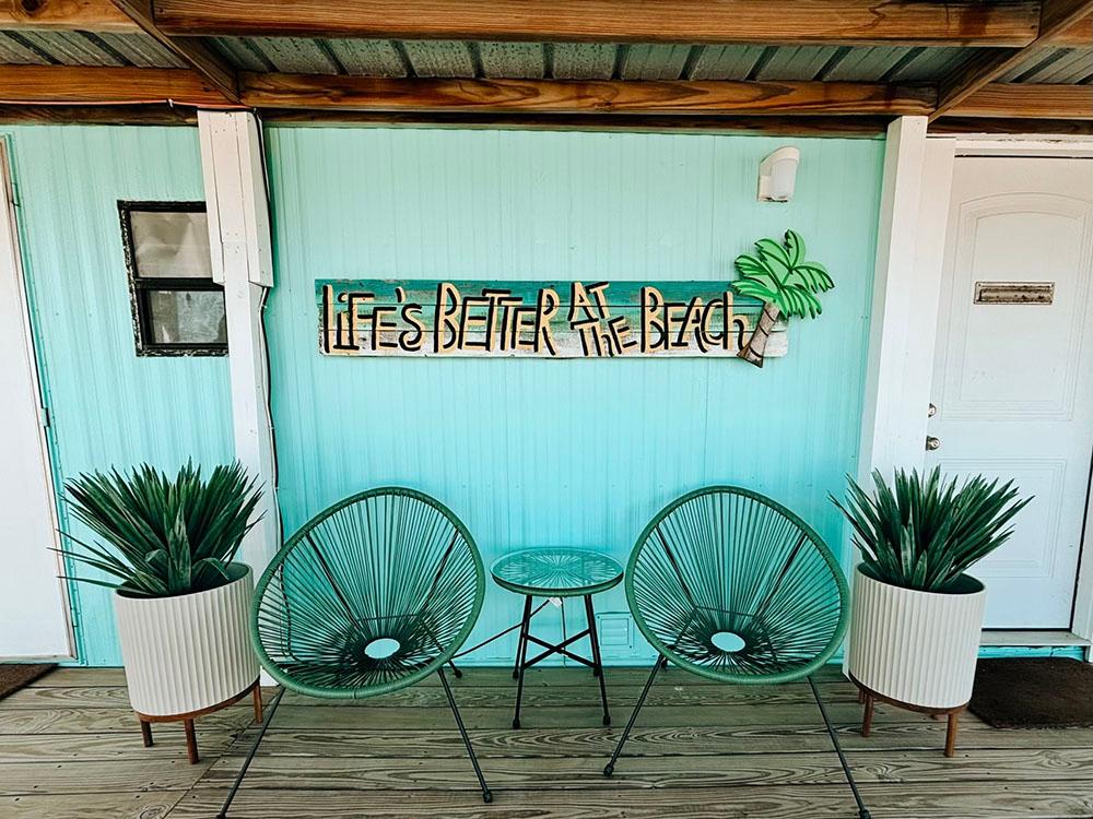 Life's Better at the Beach sign on a building at SANDOLLAR RV PARK