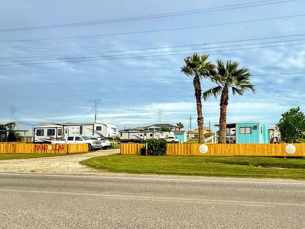 The road outside the entrance to the park at SANDOLLAR RV PARK