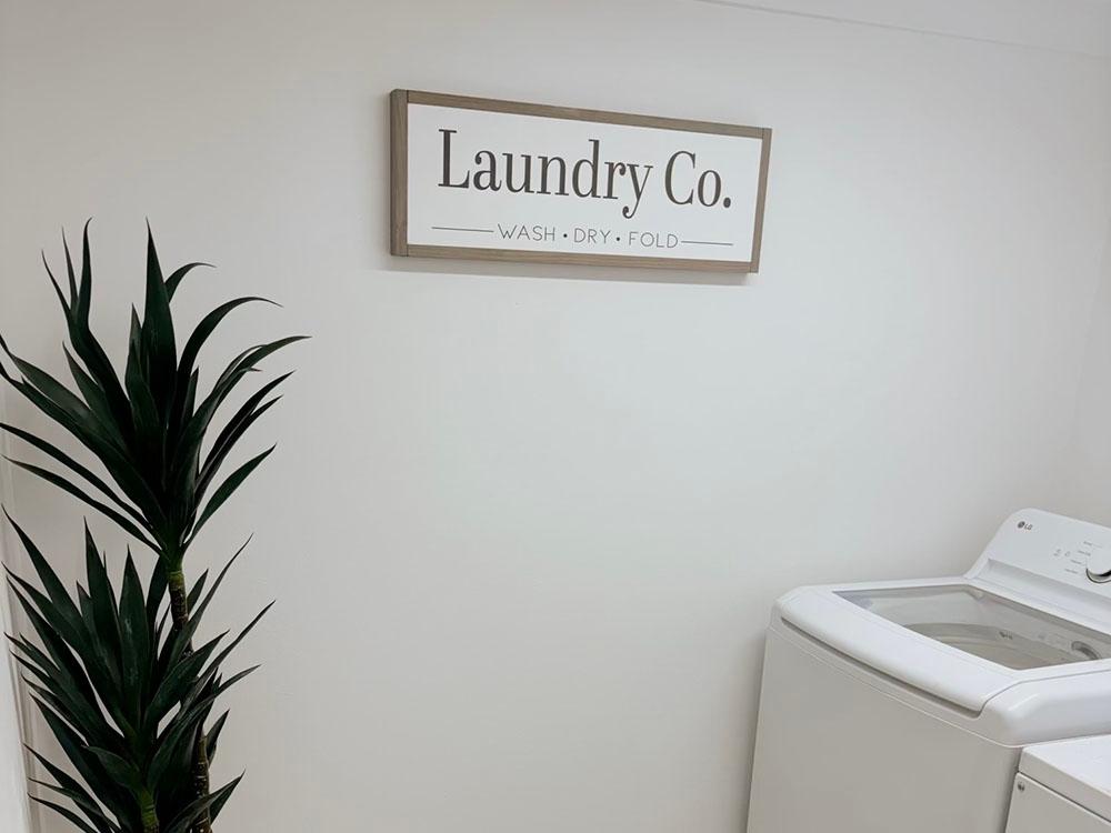 A washer and dryer in the laundry room at SANDOLLAR RV PARK