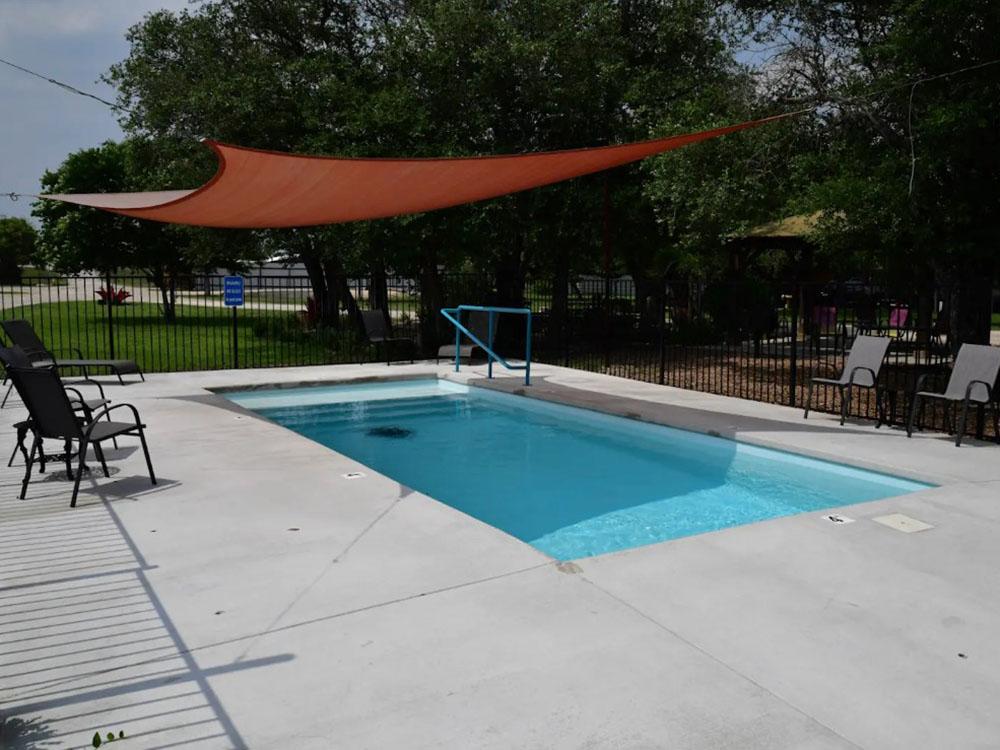 The enclosed pool area at OUR FRIENDS CAMPGROUND