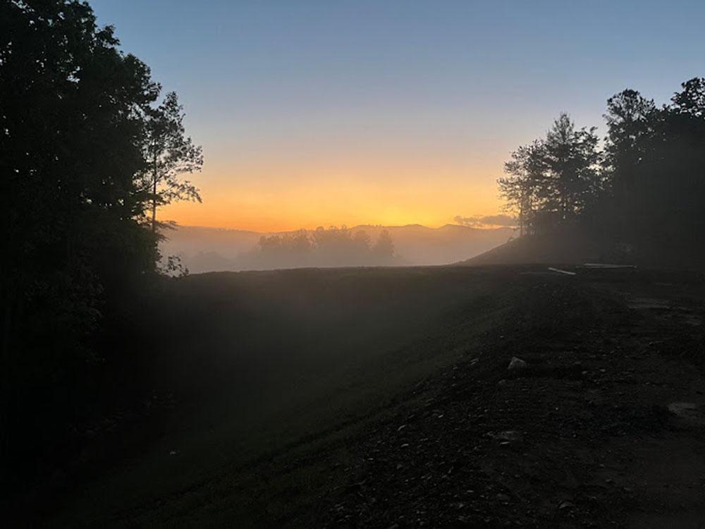 Hillside at sunrise at TALKING ROCK MOTORCOACH RESORT