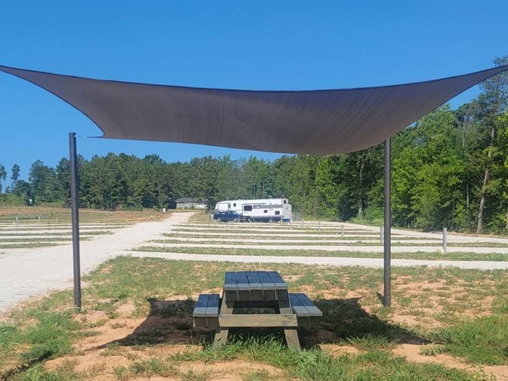 A shaded picnic table at The Escapes RV Park & Storage