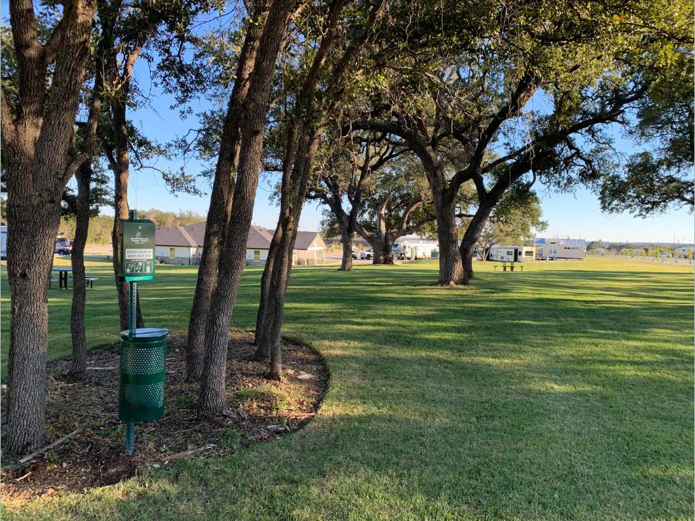 A shady greenbelt at LHTX RV Resort