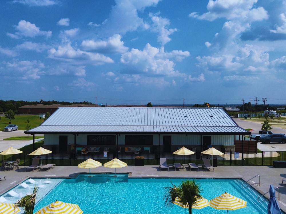 The pool area and office building at LHTX RV Resort