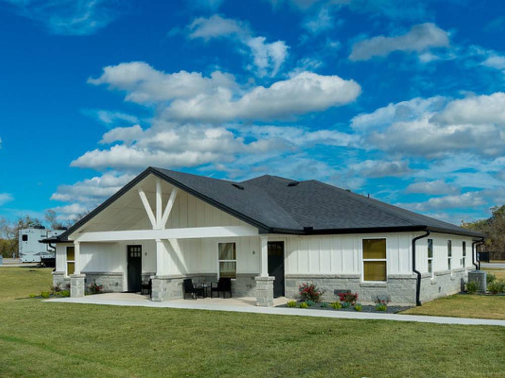 Exterior of a white building at LHTX RV Resort