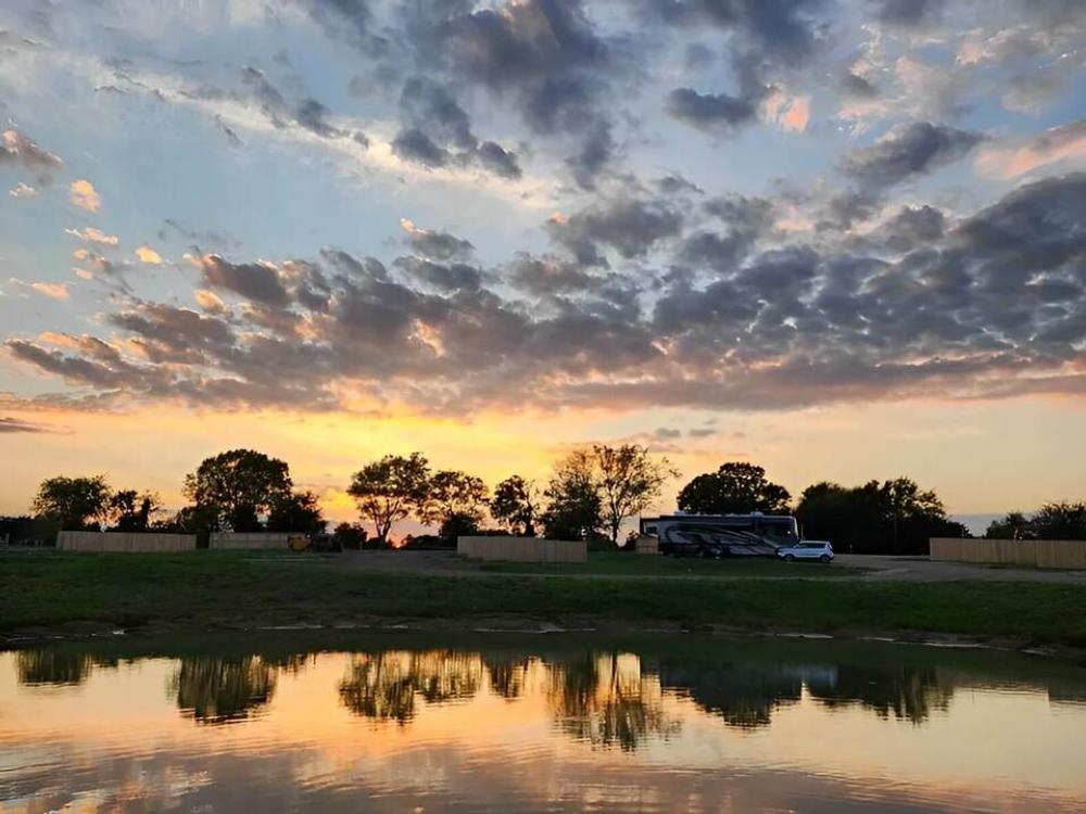 The sun sets over sites at Cowboys RV Park