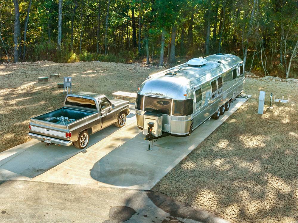 Airstream and classic truck at a site at Blue Springs RV Park