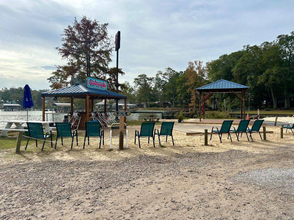 The bar and seating area by the lake at Mill Creek Marina & Campground