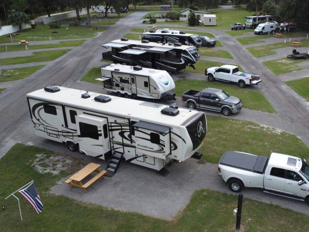 RVs parked in pull-through sites at Old Florida RV Resort