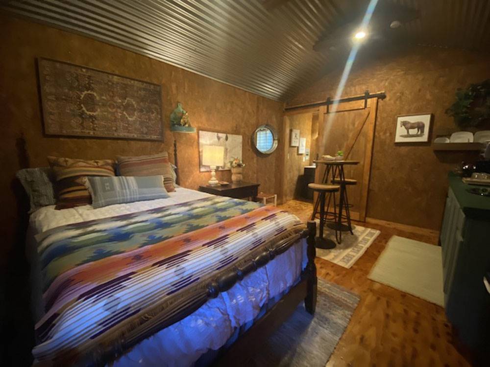 A rental cabin bedroom at The Woods RV and Cabin Resort