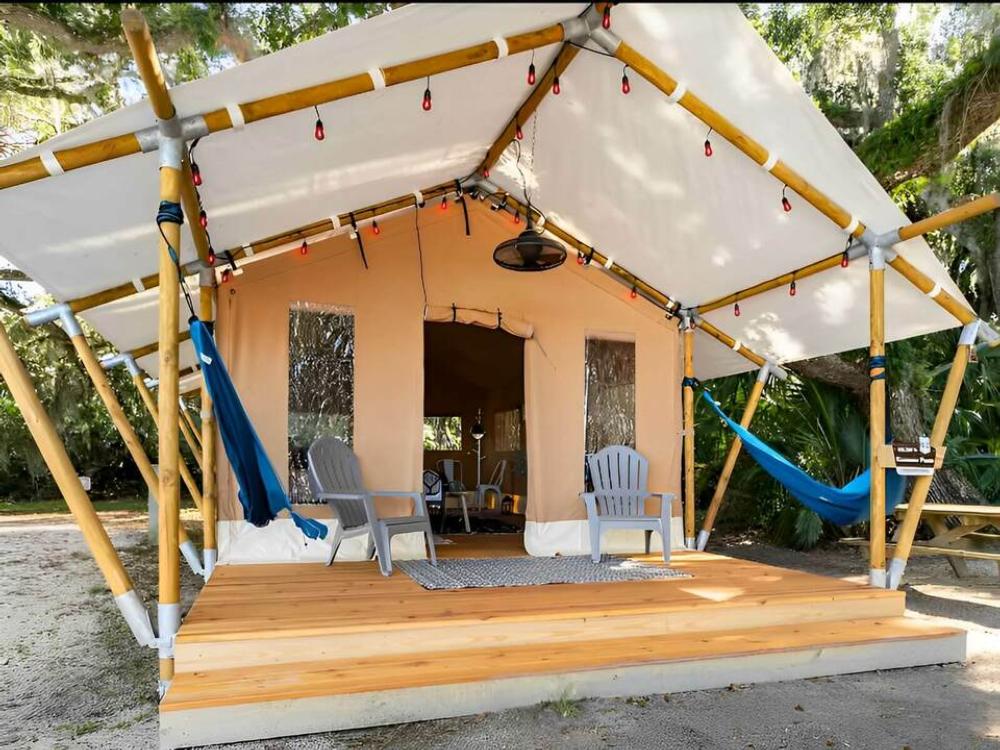 Safari Glamping tent with hammocks and deck at Timberline Glamping at Kissimmee Prairie