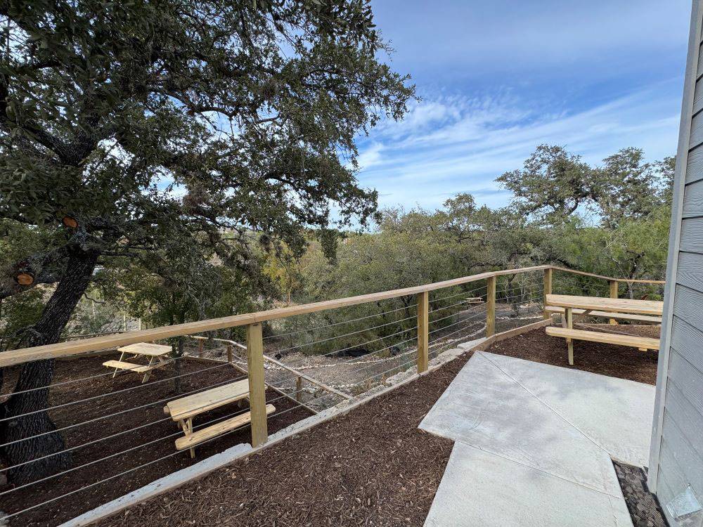An elevated area overlooking picnic tables