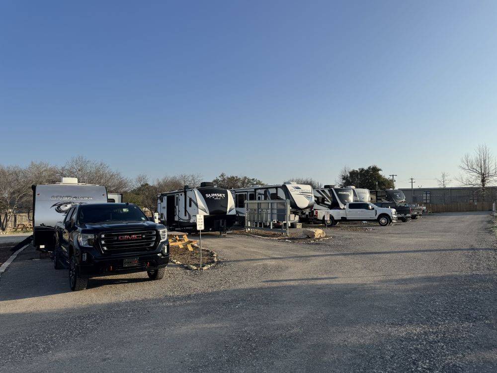 A row of travel trailers parked at site