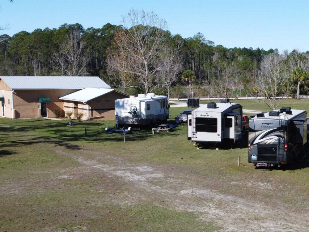 Grassy rv spot at Jasmine Breeze RV Park
