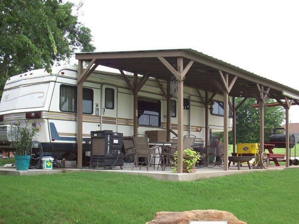 An RV at site with covered patio at 429 Marina and Resort