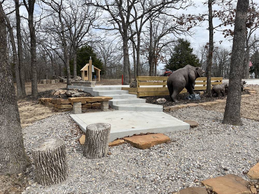 A bear statue and concrete steps