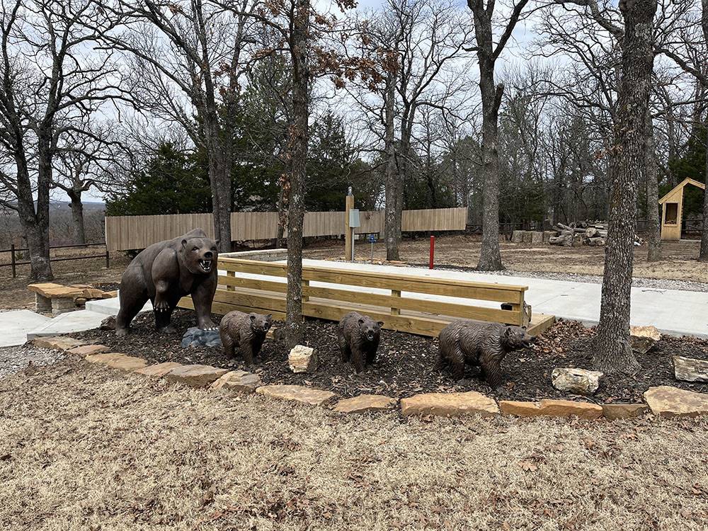 Mama bear and three cub statues