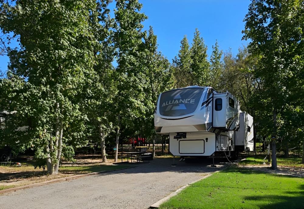 Parked trailer at site Big Tex Campgrounds