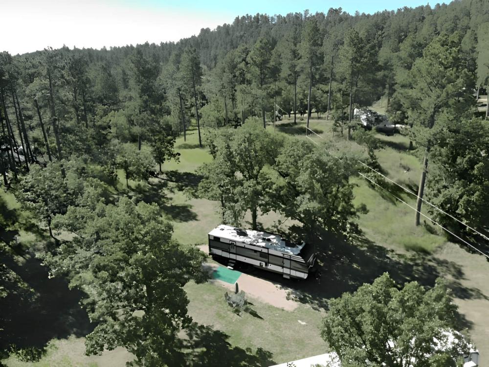 Parked trailer at site Cloud Nine Camping