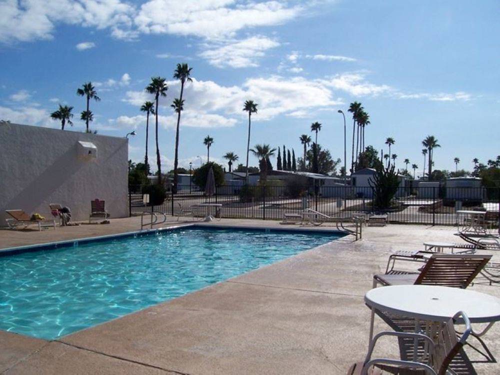 Lounge seating around the enclosed pool