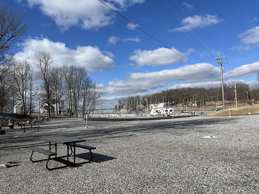 A picnic table at a gravel site