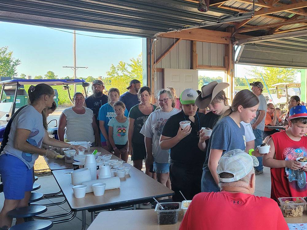 People in line for food in the pavilion