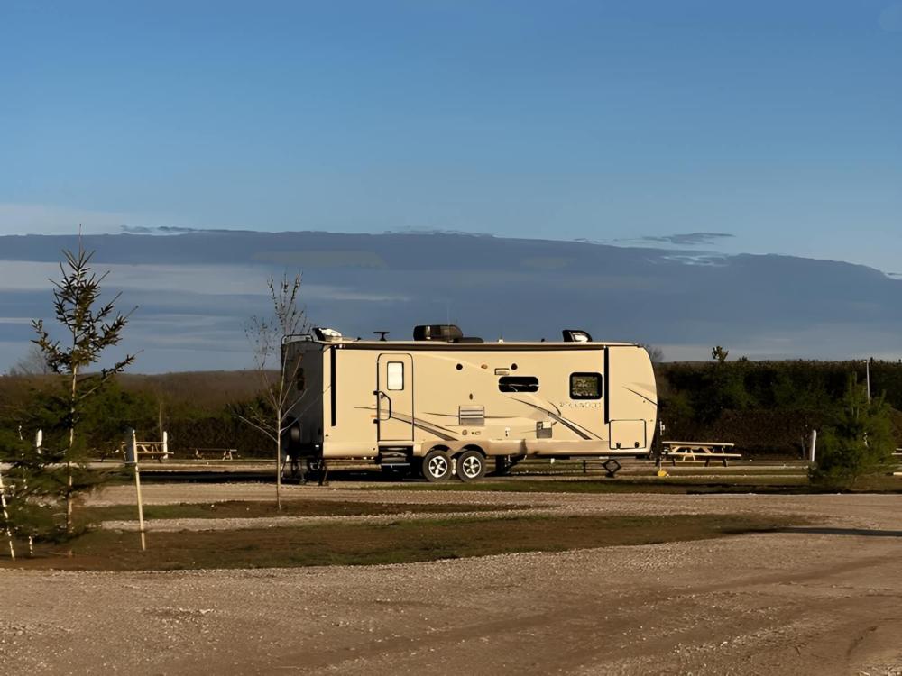 Parked trailer at site Blue Lakes Adventure Camp