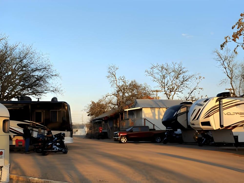 Parked trailer at site River Trail Cottages & RV Park