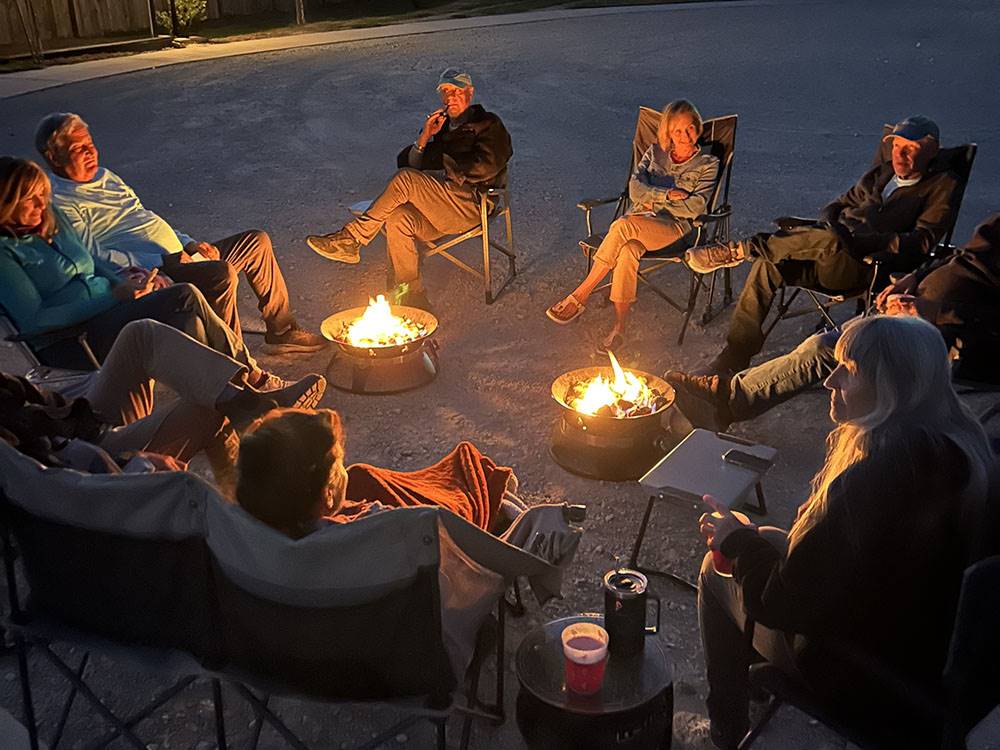 People gathering by the fire pit