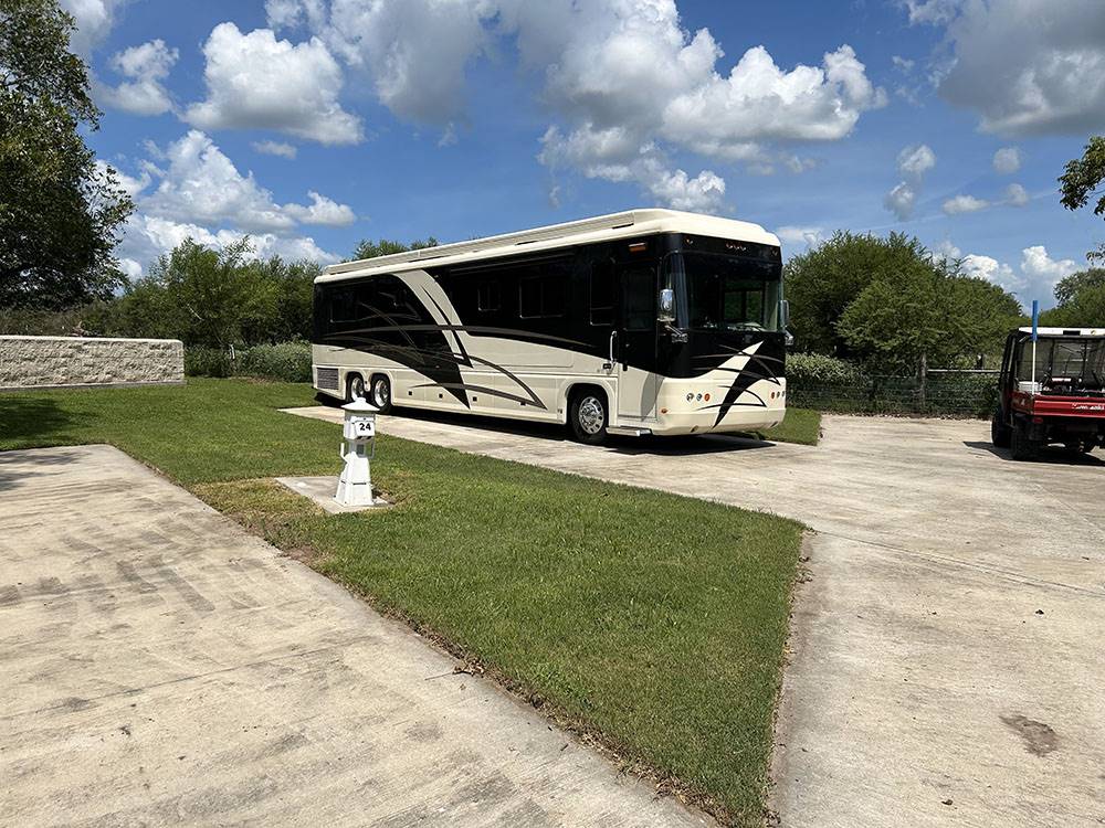 A motorcoach parked in a paved site