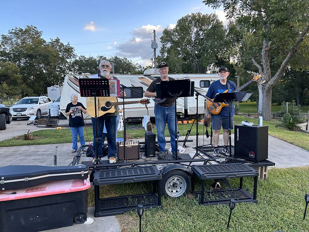 A three piece band performing for guests