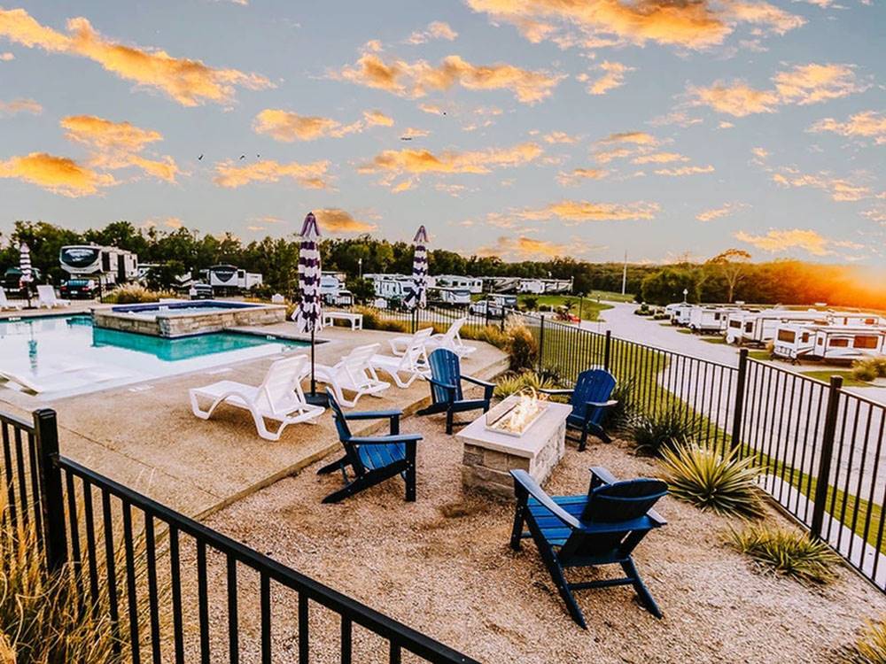 Fire pit near the pool and hot tub
