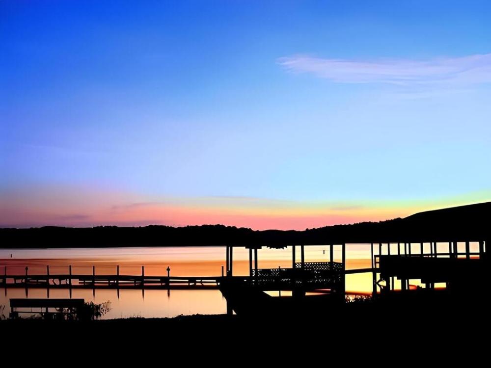 The boat dock against the sunset at Higgins Ferry Park