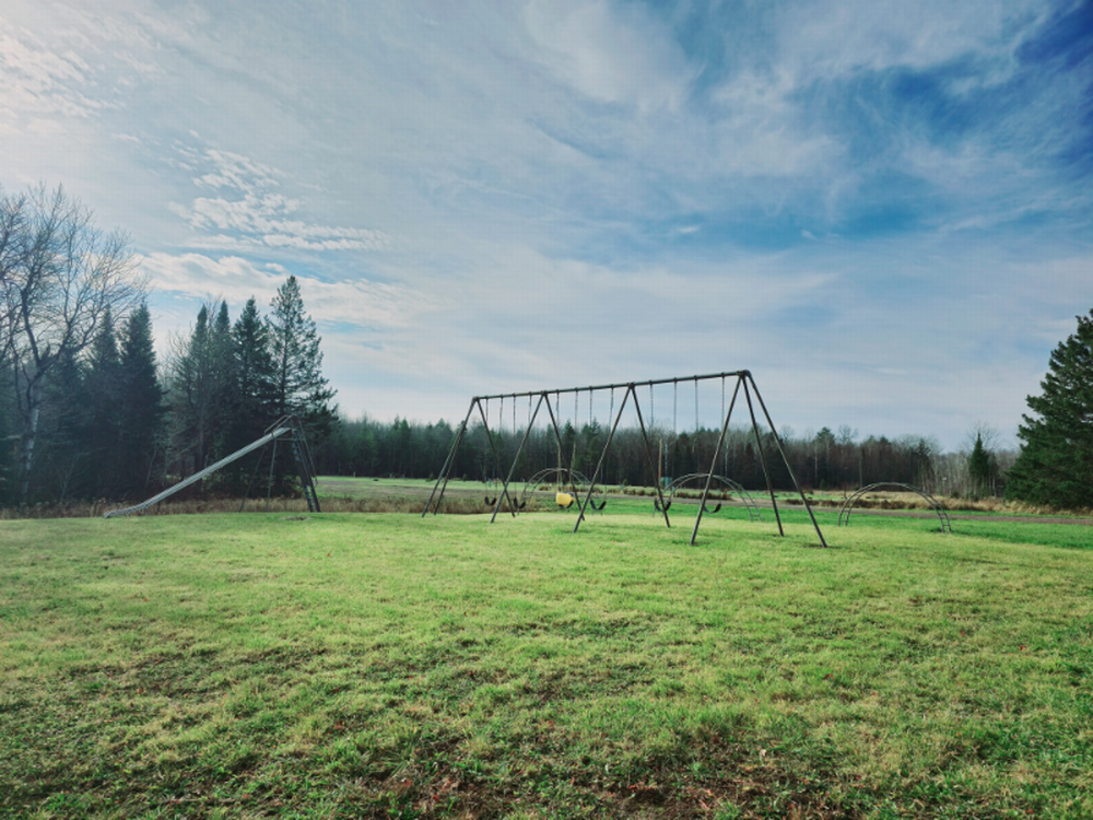 A swing set at Stargazers UP Campground