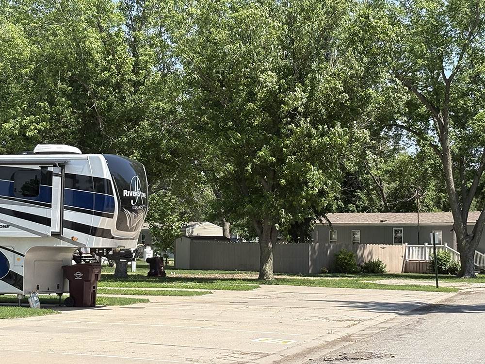 A fifth wheel parked at a site