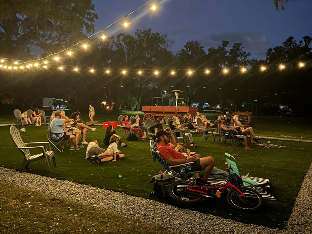 People watching a show under night lights