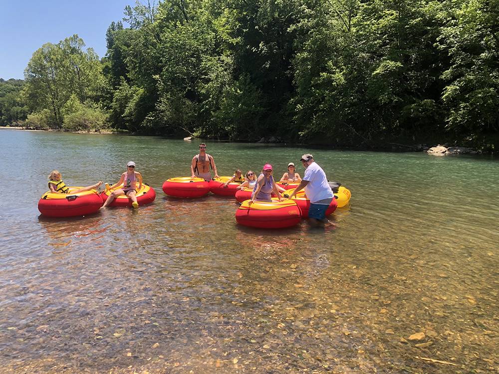 A group of people on innertubes