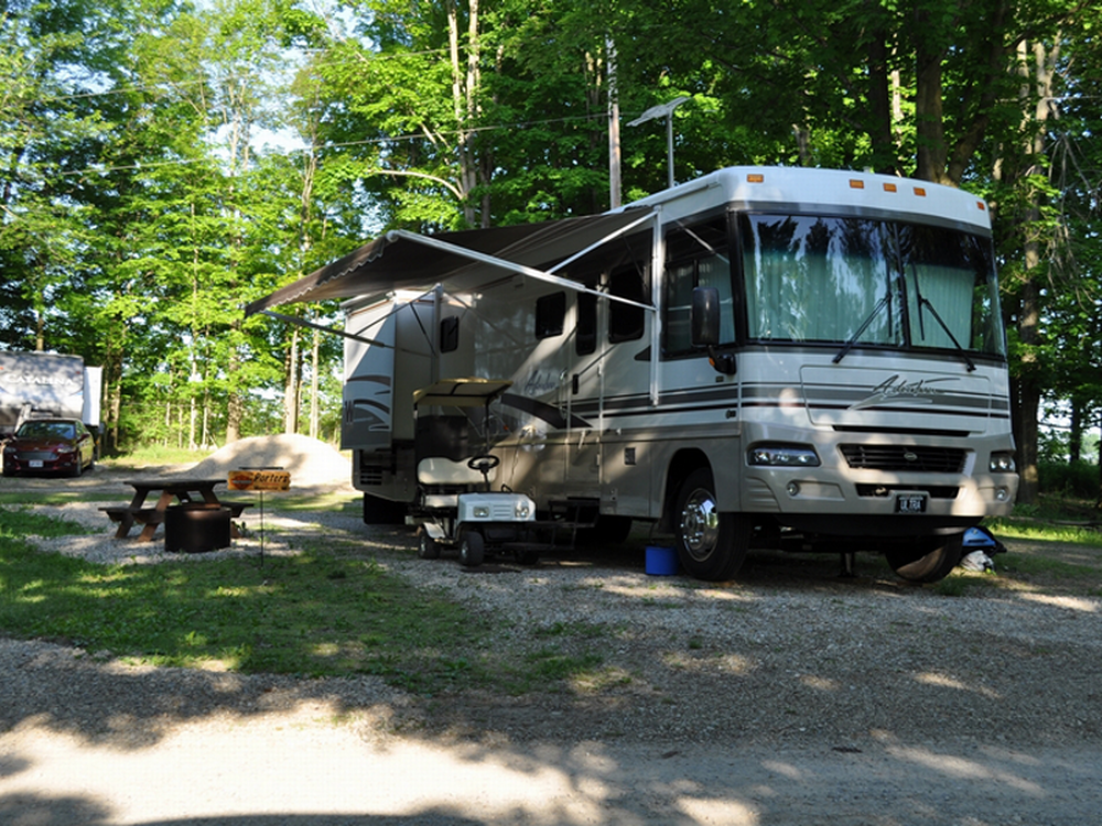 Large RV in a shady site