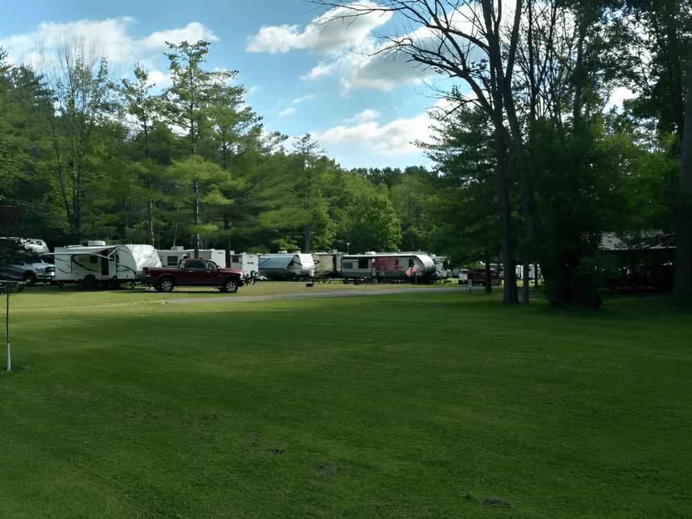 Shaded RV sites and large lawn area