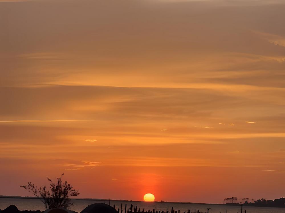 An orange sunset at Bells Island Campground